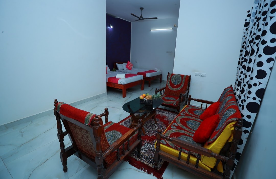 Suite sitting area opening to beds at Lacasa